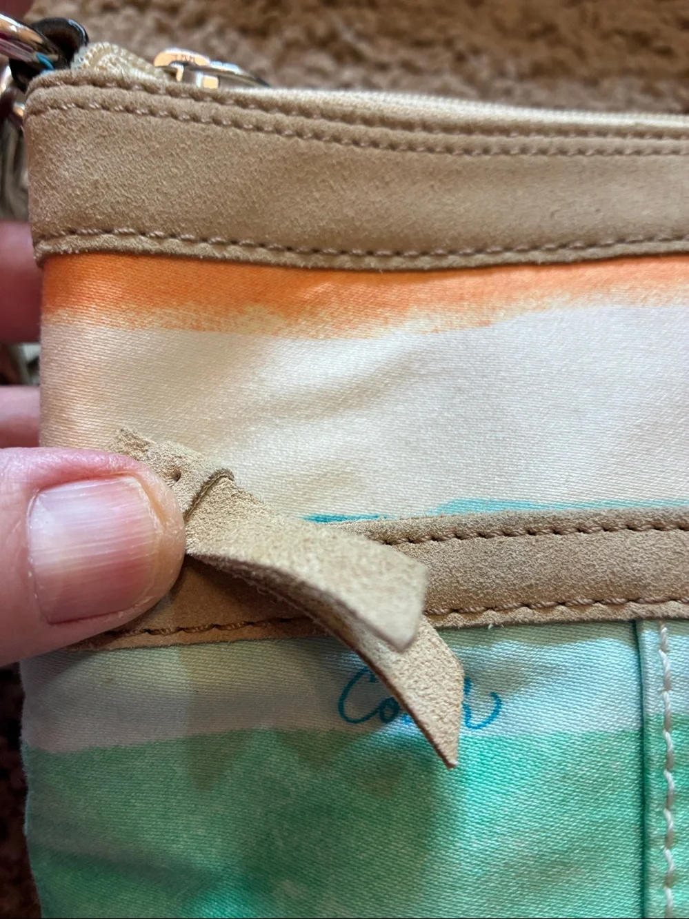 Coach Multicolor Canvas Crossbody bag with Turquoise Lining.